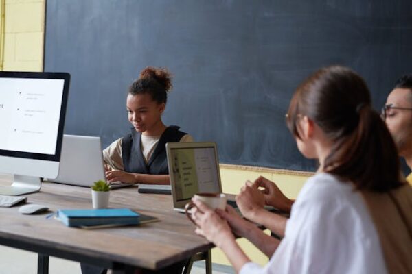 Students in classroom working on laptoops.